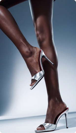 AI footwear ad — metallic silver heels